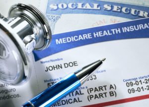 Medicare card on top of a Social Security card